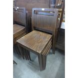A set of four beech stacking chairs