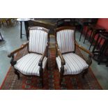 A pair of 19th Century French Empire style mahogany and upholstered fauteuils