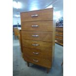 A teak chest of drawers