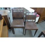 A set of four beech stacking chairs