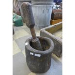 A large 19th Century carved hardwood pestle and mortar
