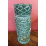 An oriental carved green hardstone brush pot