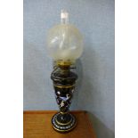 A Victorian painted black glass oil lamp