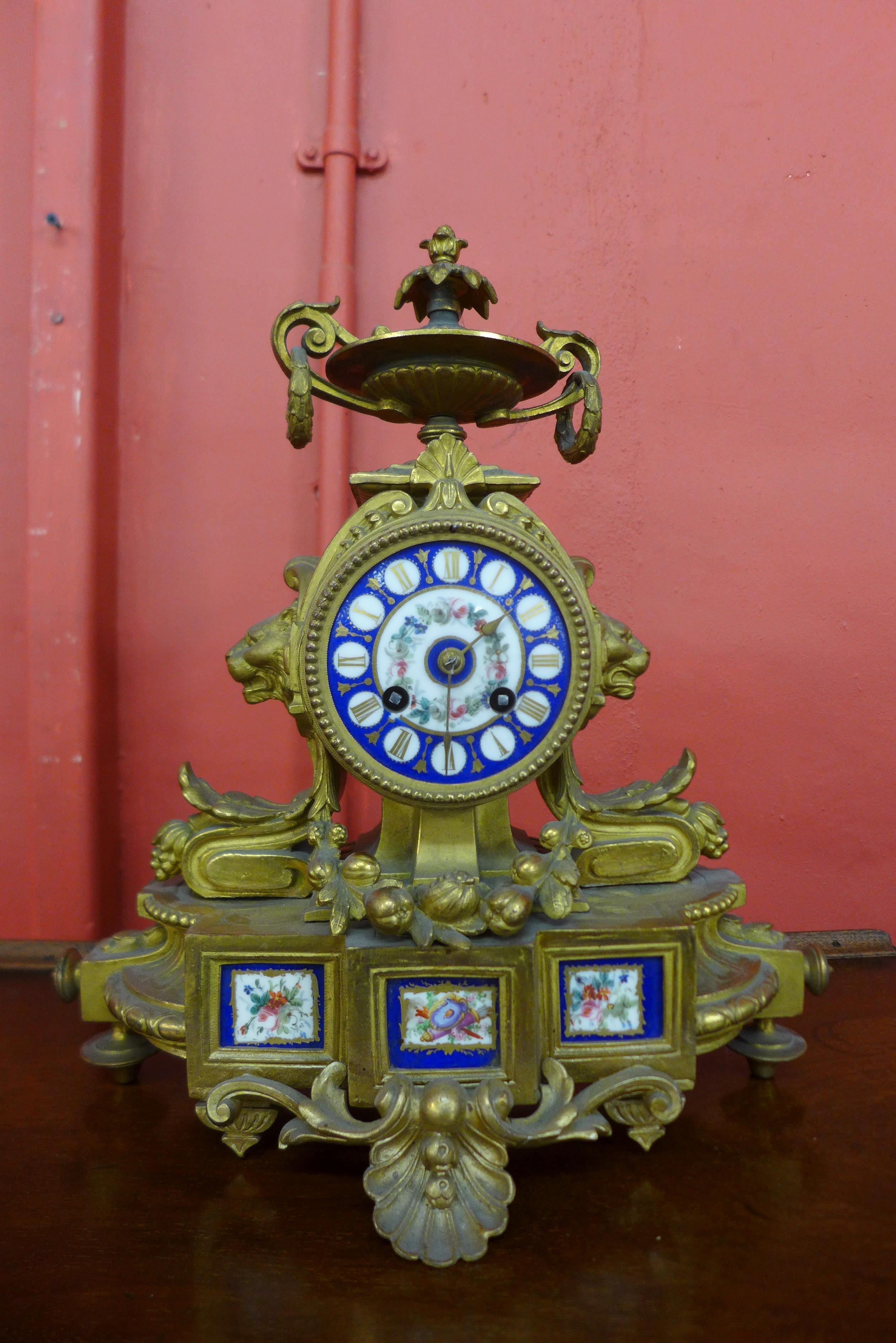 A 19th Century French gilt metal and and Sevres style porcelain mantel clock