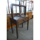 A George III oak book press on stand