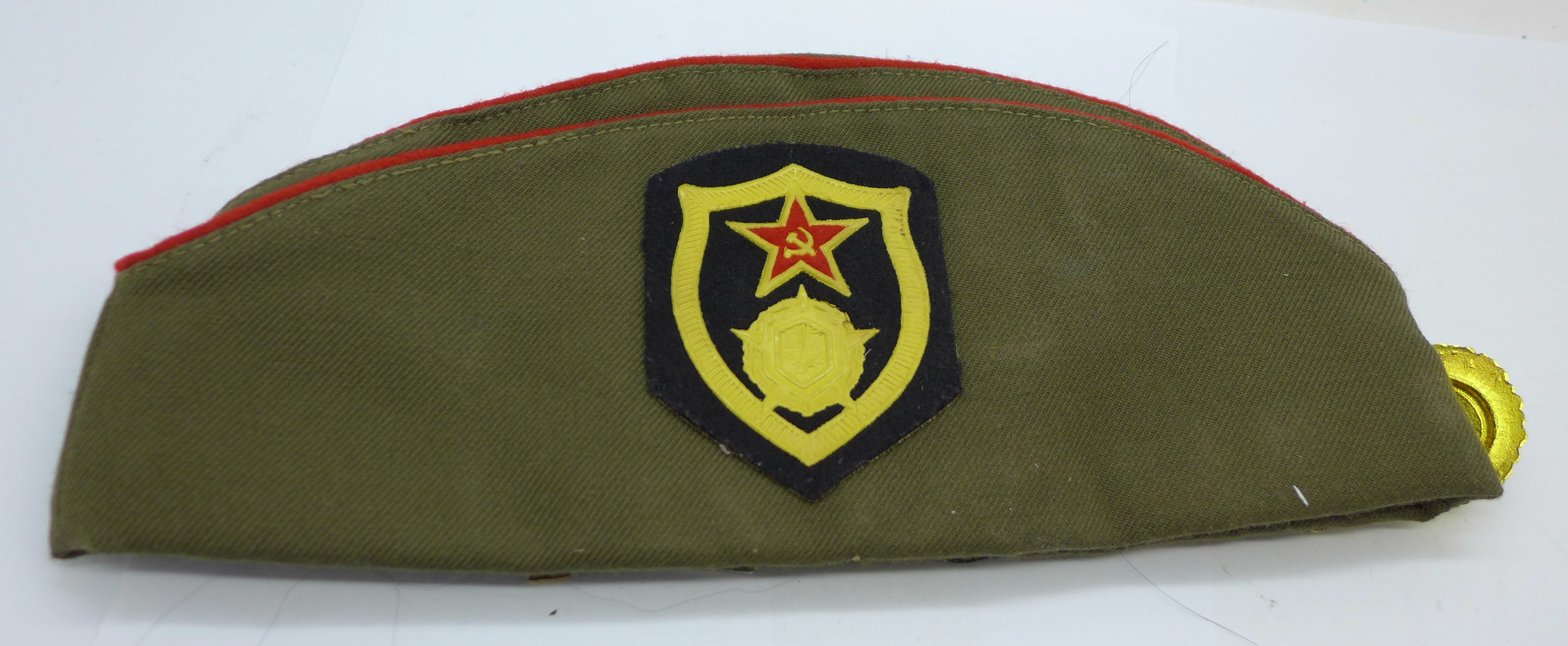 A Soviet cap with a collection of badges - Image 4 of 5