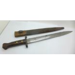 A British late 19th Century bayonet with scabbard, the blade marked, VR 1 98, also EFD under broad