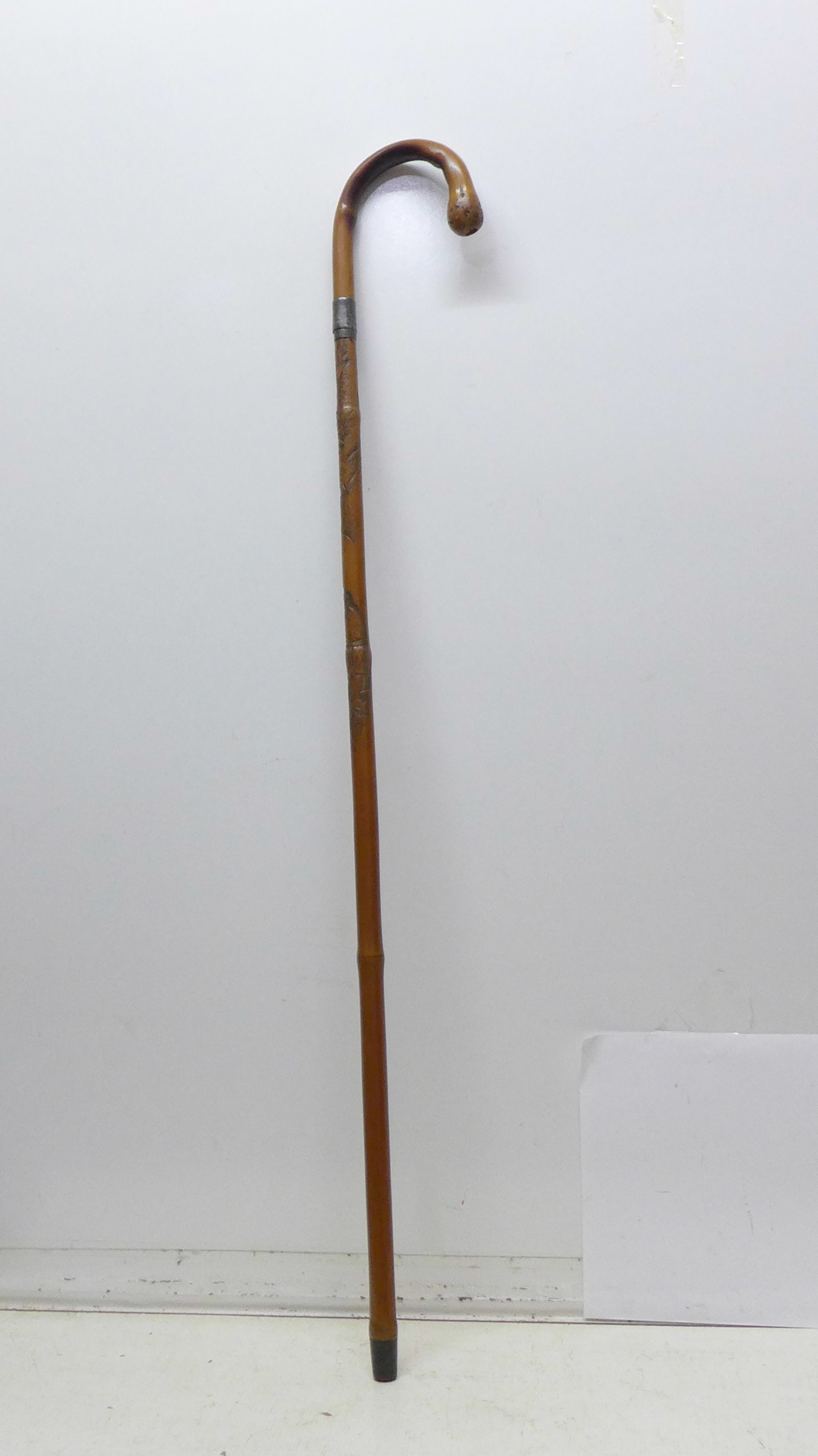 A 19th Century bamboo sword stick with oriental carved decoration and triangular blade, length 72.