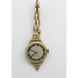 A lady's 9ct gold wristwatch on a 9ct gold bracelet strap, weight without movement 12.2g, 22mm case