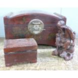 A Chinese casket, a wooden box and a carved figure of an elder