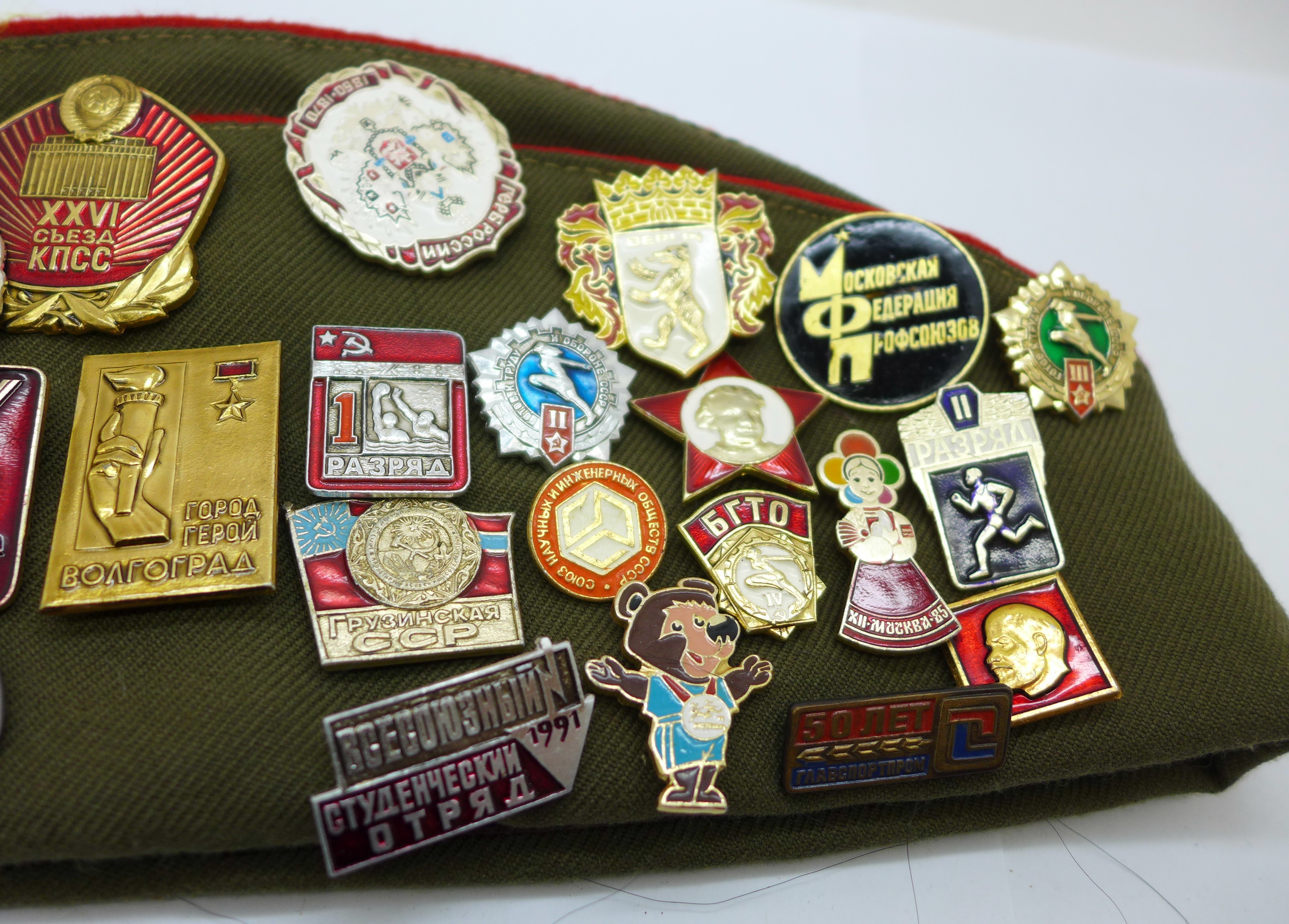 A Soviet cap with a collection of badges - Image 3 of 5