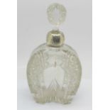 An Edward VII silver mounted cut glass bottle in the shape of a horseshoe, Birmingham 1902, bears