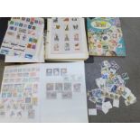 A collection of worldwide stamps including France, United States of America, Canada, and an album of