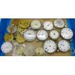 A collection of pocket watches and movements