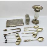 A collection of silver spoons and a pair of silver sugar bows, 97g, a cigarette case with an