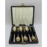 A set of six silver spoons, cased, 57g