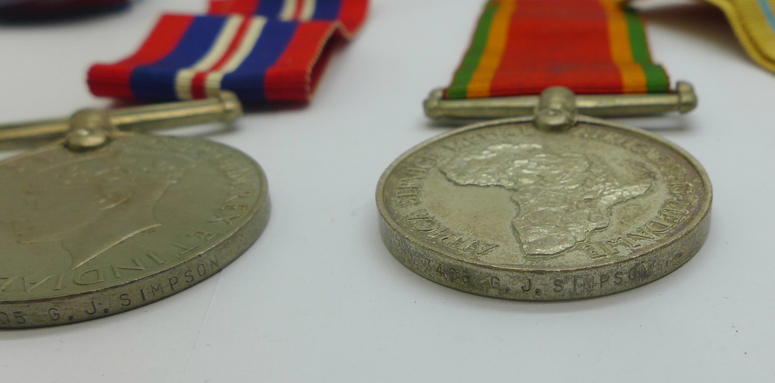 Four WWII medals including Africa Service Medal to 113405 G. J. Simpson with compliment slip - Image 7 of 7