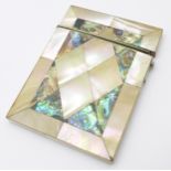An abalone mother of pearl card case, 78mm x 101mm, (hinge strained, fastener requires repair)
