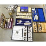 A collection of silver plated items including sets of spoons and knives, a fish knife set, a mug,