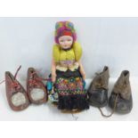 A 1950's Hungarian doll and two pairs of children's shoes