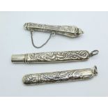 Three silver needle cases