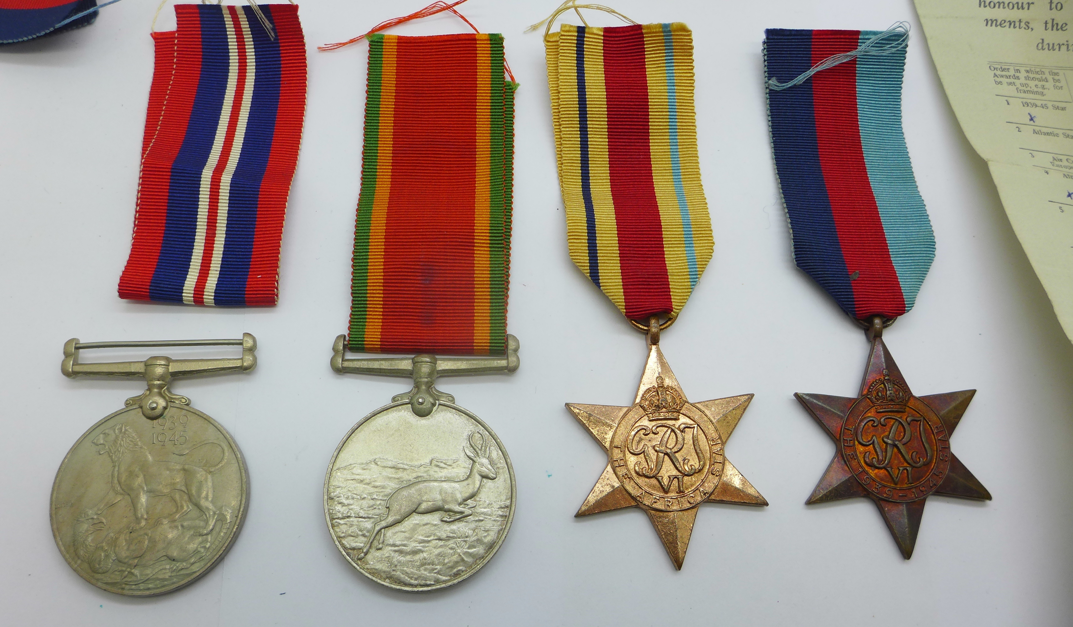 Four WWII medals including Africa Service Medal to 113405 G. J. Simpson with compliment slip - Image 2 of 7