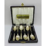 A set of six silver spoons, cased, 57g