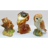 Three Beswick figures; Barn Owl, Pekinese dog and Cheshire Cat