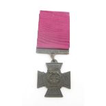 A replica Victoria Cross medal