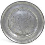 A pewter wriggle work charger, dated 1691, 38.5cm