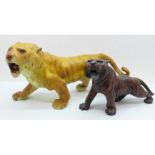 Two cold painted figures of tigers, largest 23.5cm