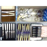 A collection of flatware, some cased