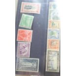 A folder of stamps and stamp booklets