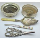 A pair of plated grape scissors, two wine coasters, a server and a Royal Crown Derby knife