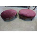 A pair of Victorian carved walnut footstools