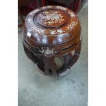 A Chinese hardwood and mother of pearl inlaid barrel shaped stool