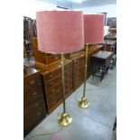 A pair of brass standard lamps