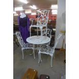 A painted cast alloy garden table and four chairs