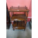 A Victorian walnut Canterbury whatnot