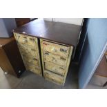A pair of industrial style painted pine and mahogany four drawer chests