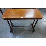 A Victorian mahogany stretcher table