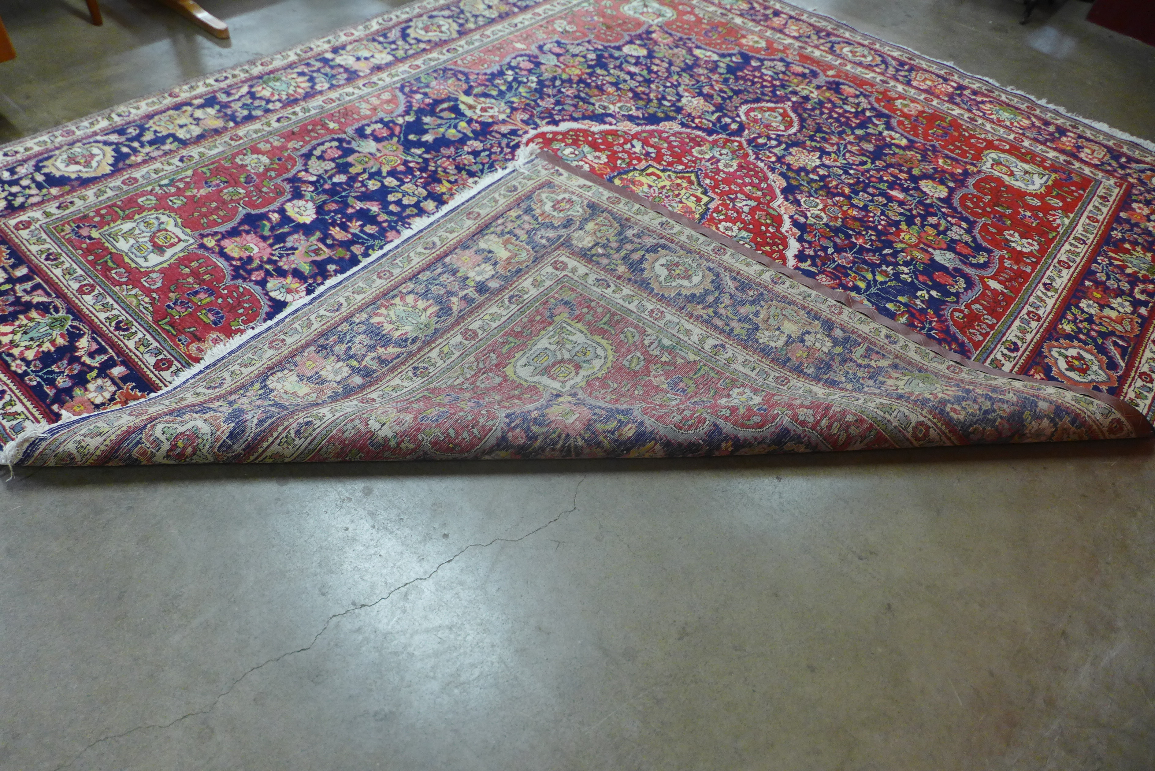 A large Persian red ground geometric patterned Tabriz rug, 355 x 304cms - Image 2 of 2