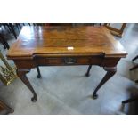 A George II mahogany rectangular fold over tea table