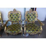 A pair of French Louis XV style giltwood and fabric upholstered fauteuils