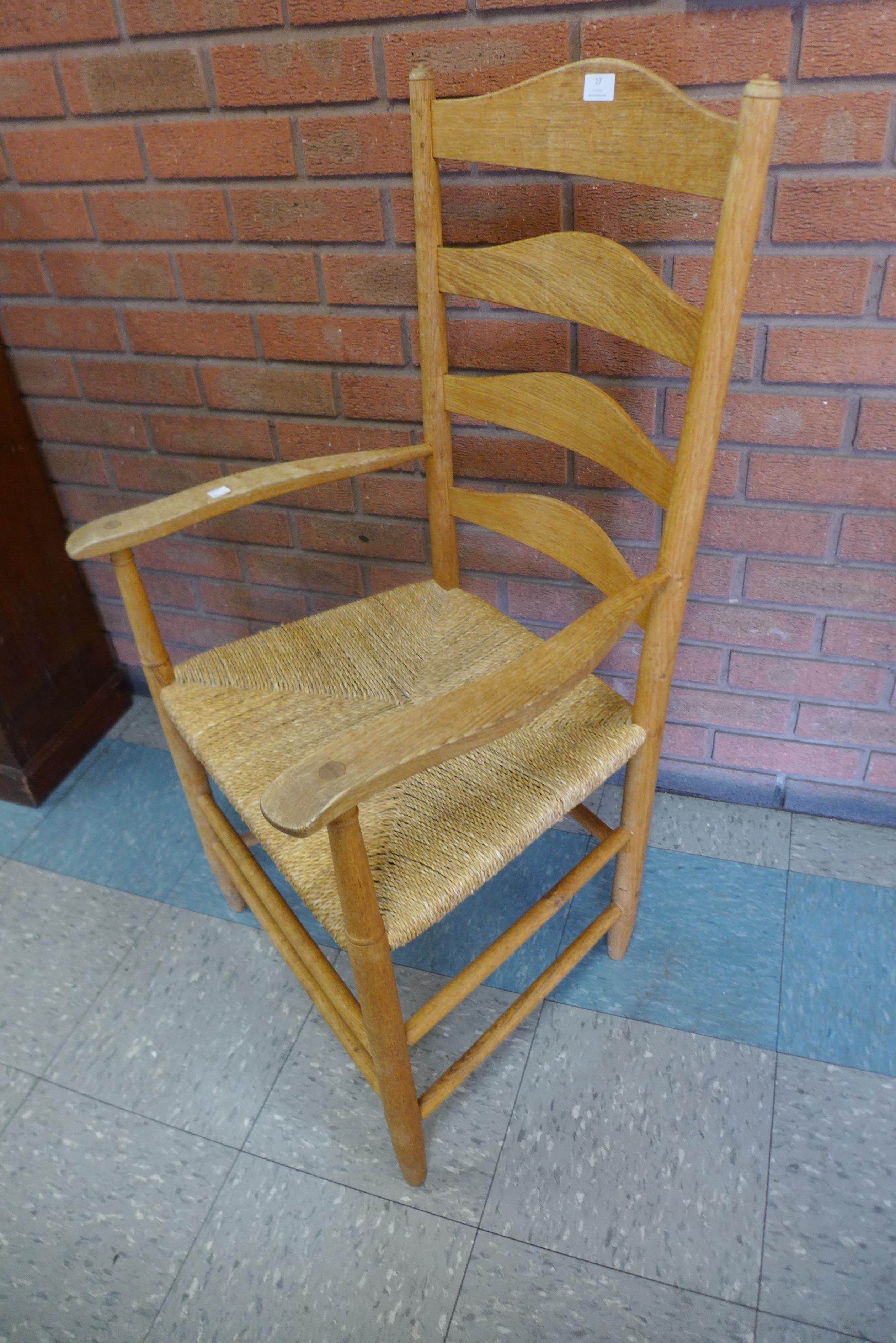 A pair of Arts and Crafts Cotswold School oak rush seated ladderback elbow chairs, attributed to - Image 2 of 2