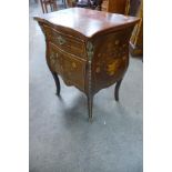 A French Louis XV style inlaid mahogany and gilt metal mounted bombe shaped petit commode