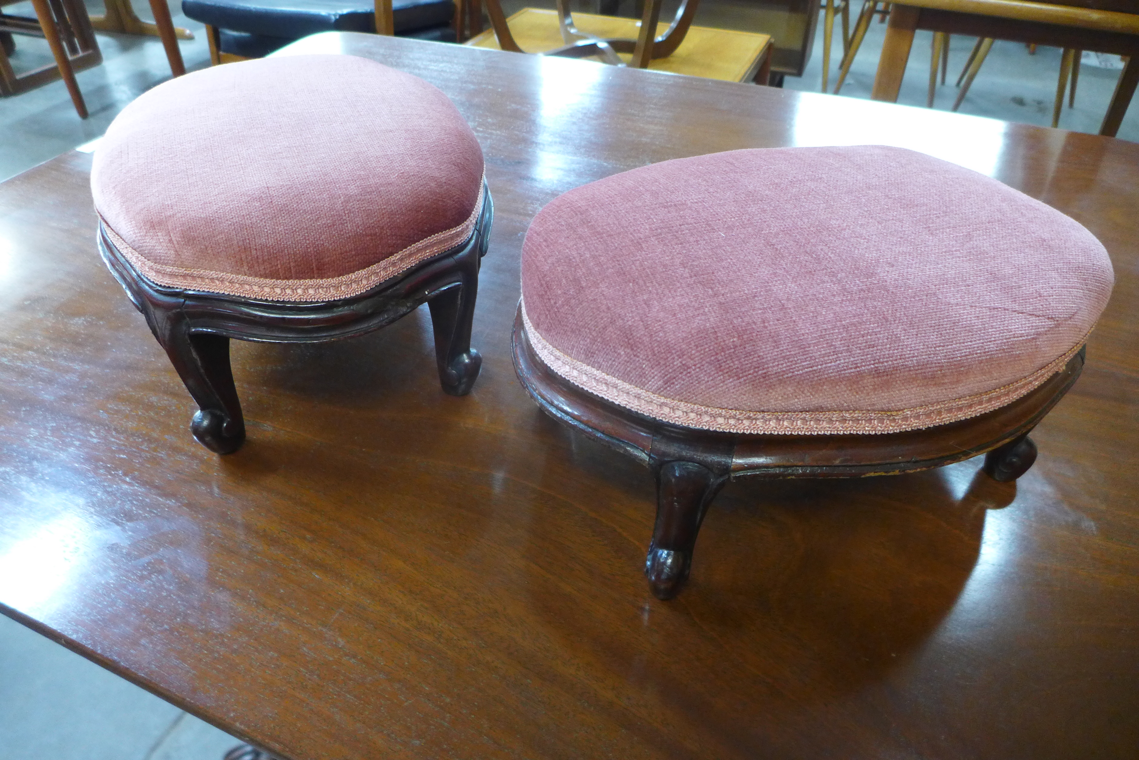 A pair of Victorian mahogany footstools