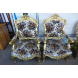 A pair of French Louis XV style giltwood and fabric upholstered fauteuils