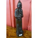 An oriental carved hardwood figure of a sage