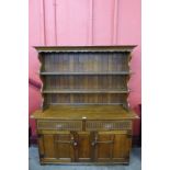 A Nigel Griffiths carved oak dresser